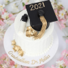 white and gold graduation cake