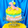 colorful star dinosaur cake