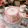 classic vintage pink ribbon cake
